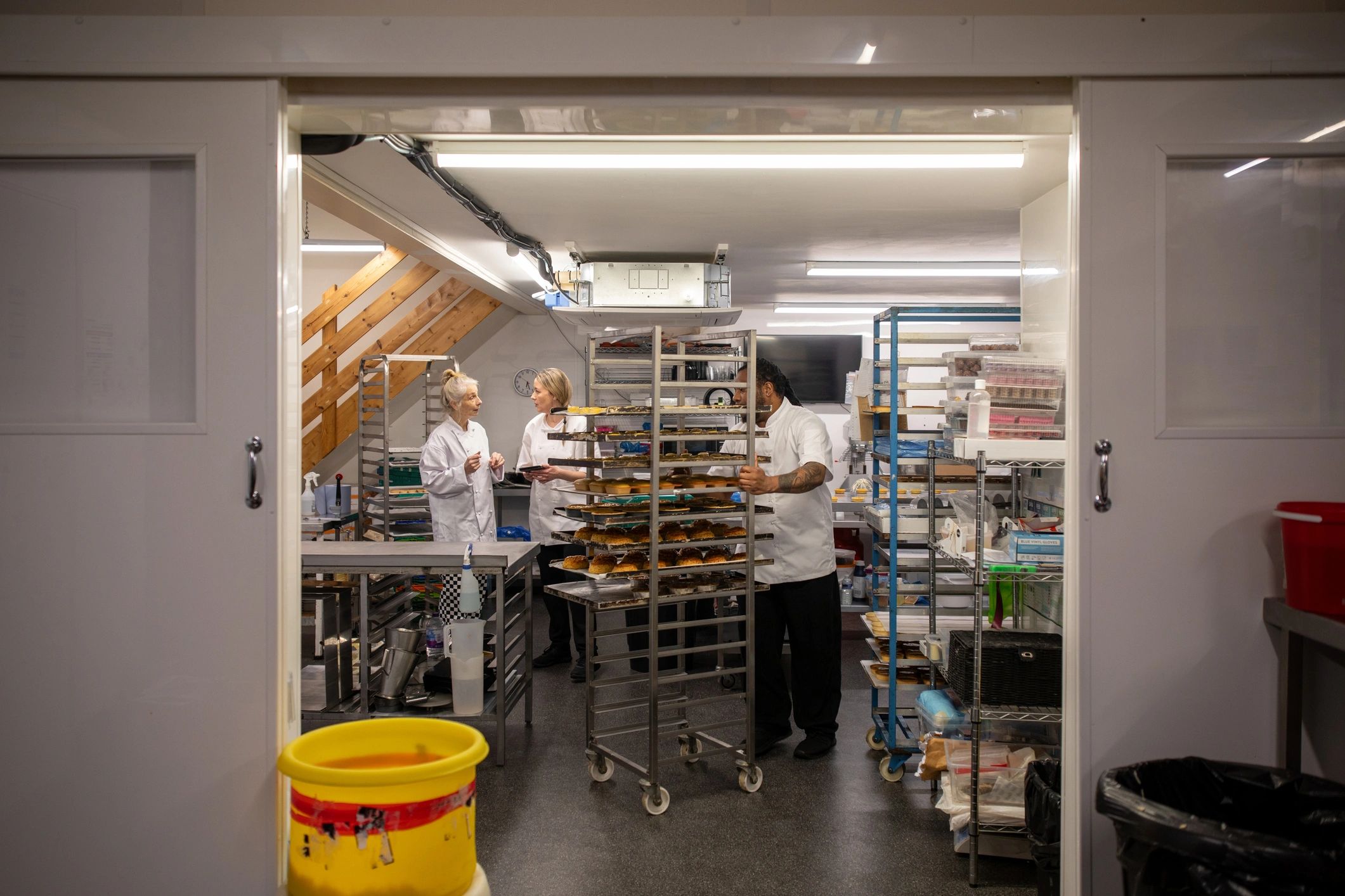 Agricultural production team collaborating in a processing facility